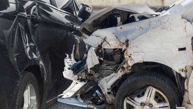A close-up of a T-bone car wreck involving two vehicles.